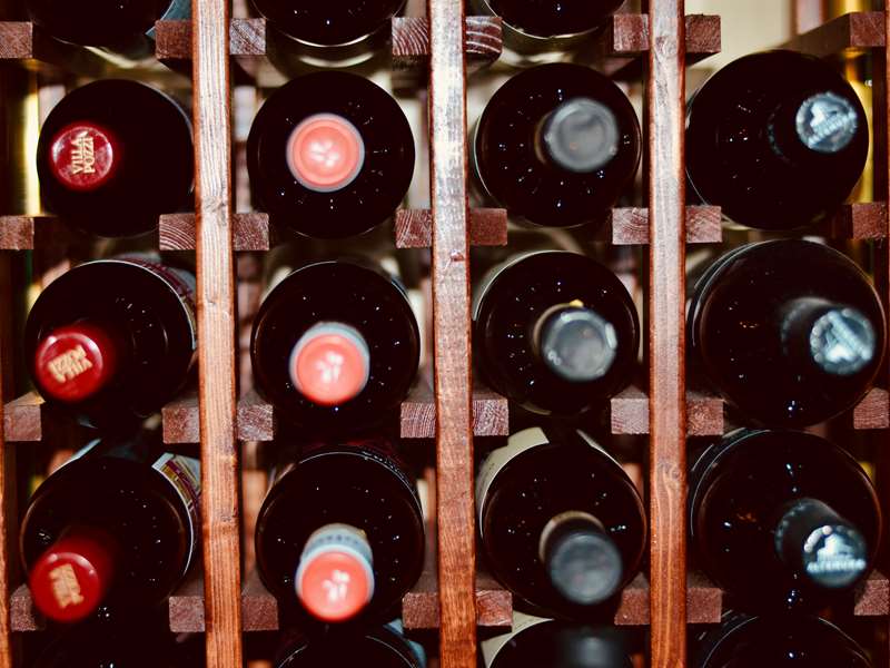 Wine rack filled with red wine